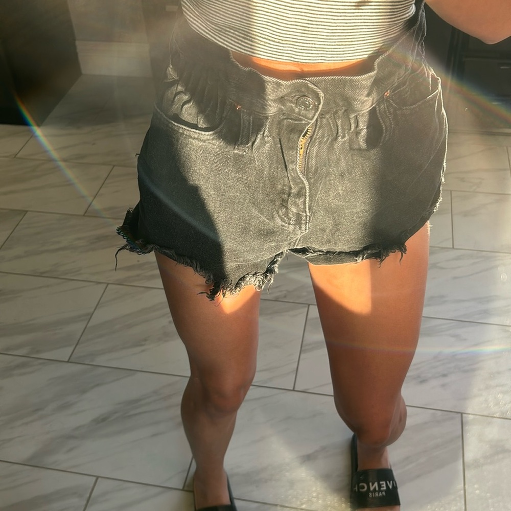 Black cinched jean shorts